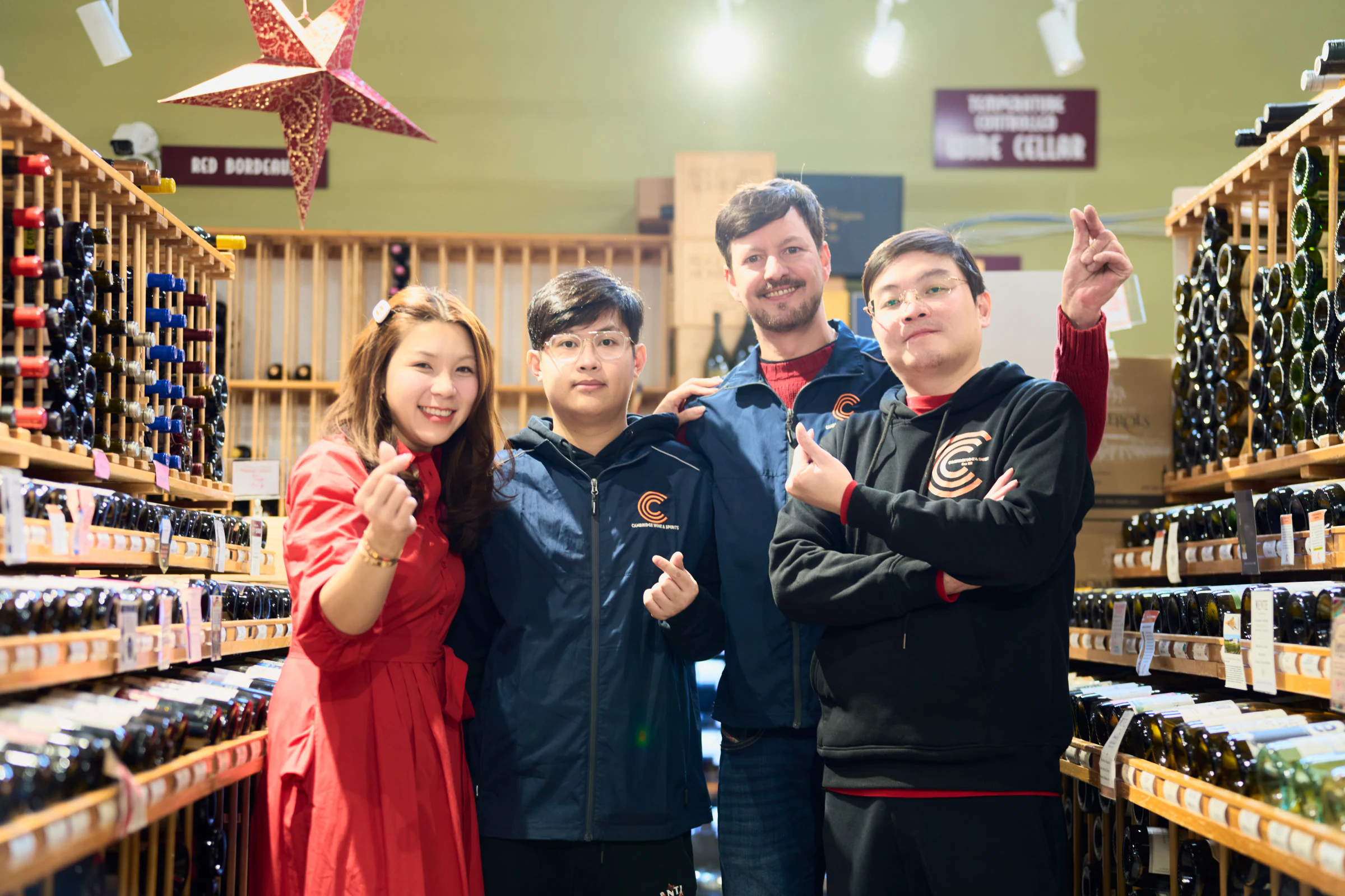 Team members in the wine department of a retail store